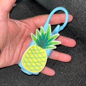 Pineapple hand sanitizer holder not sure of the brand  more square shape.